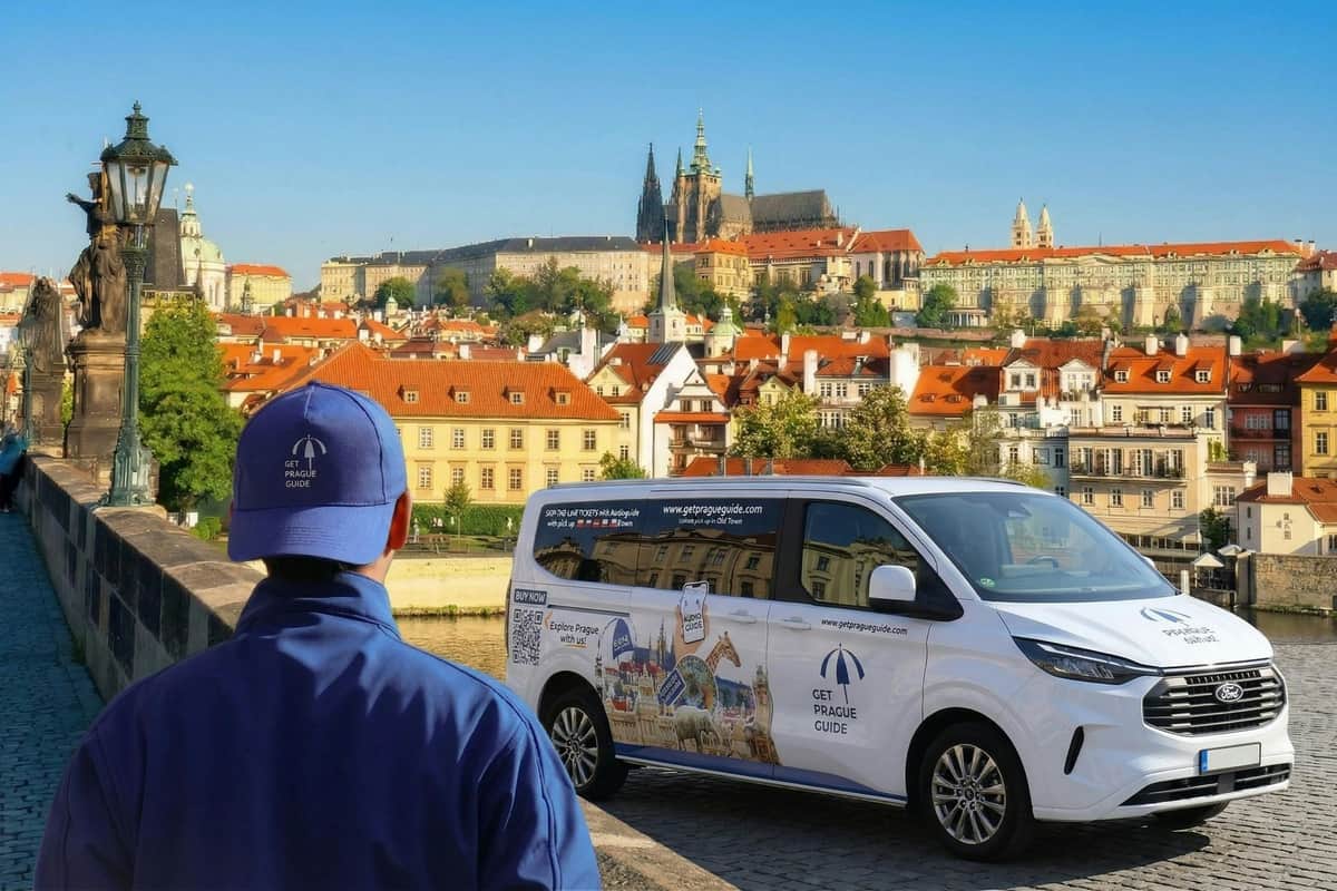 A person in a blue uniform stands near a van with 'Get Prague Guide' branding, with Prague Castle visible in the background.