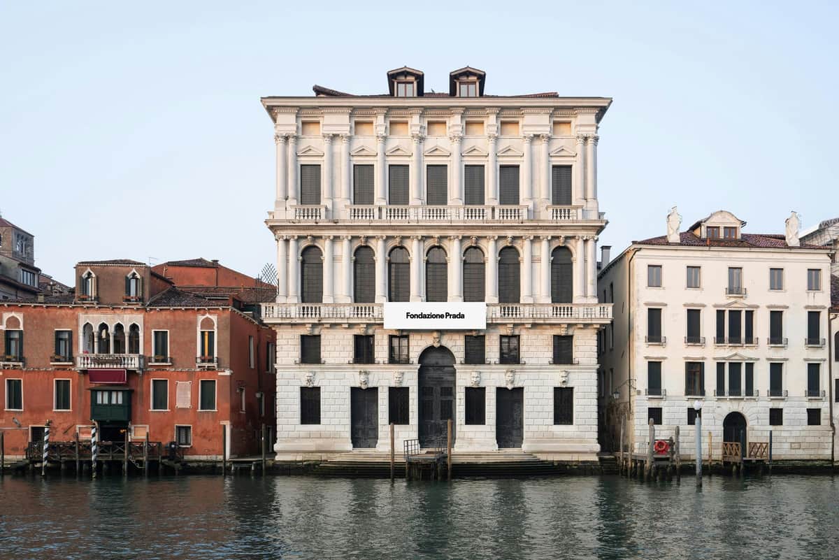 Fondazione Prada: Entry Ticket A classic-style building housing the Fondazione Prada, situated beside a canal amongst the neighbouring buildings in Venice.